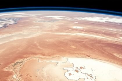 A high-resolution image of Lake Eyre in Australia, with a mix of dry and wet areas, and a NASA satellite in the background, to represent the intersection of science and nature.