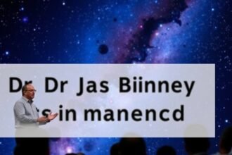 A photo of Dr James Binney speaking at a conference, with a background of stars and galaxies.